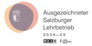 Lehrlingsportal.at Logo mit Salzburger Landeswappen und sich überschneidenden Kreisen, Text "Ausgezeichneter Salzburger Lehrbetrieb 2024-29" mit WKS- und Land Salzburg-Logo am unteren Rand.