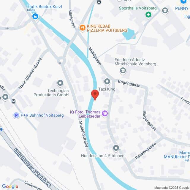 Lehrlingsportal.at Karte, die einen Teil von Voitsberg, Österreich, zeigt, mit einem Fluss, Straßen, Geschäften und Sehenswürdigkeiten wie King Kebab Pizzeria Voitsberg, Technoglas und einem Fotostudio.