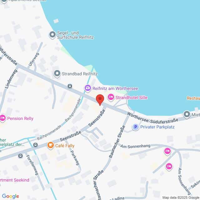 Lehrlingsportal.at Die Karte zeigt einen Ausschnitt von Reifnitz, Österreich, mit Straßen, Geschäften und Sehenswürdigkeiten in der Nähe des Ufers des Wörthersees. Eine rote Markierung zeigt einen zentralen Ort an.
