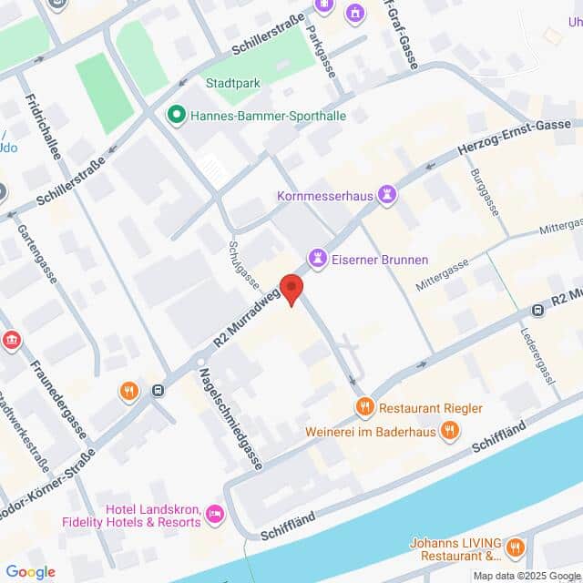 Lehrlingsportal.at Eine Karte, die die Kreuzung Mühlgasse und R2 Murroweg in Villach, Österreich, zeigt und die nahegelegenen Sehenswürdigkeiten und Geschäfte hervorhebt.