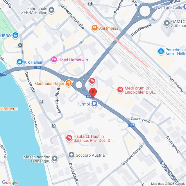 Lehrlingsportal.at Eine Karte mit Straßen und Orten in einem Stadtviertel, einschließlich Unternehmen, Kliniken und einem Fluss auf der linken Seite. Eine rote Standortmarkierung kennzeichnet eine Adresse in der Nähe einer Straßenkreuzung.