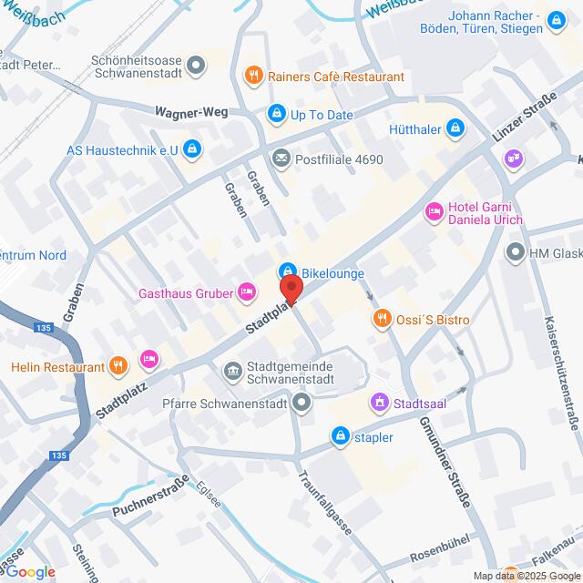 Lehrlingsportal.at Digitaler Stadtplan, der einen zentralen Bereich in Schwanenstadt, Österreich, mit verschiedenen Geschäften, Restaurants und Sehenswürdigkeiten zeigt. Eine Stecknadel befindet sich an der "Bikelounge" am Stadtplatz.