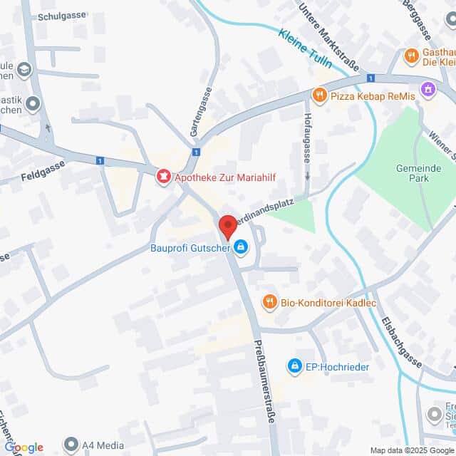 Lehrlingsportal.at Die Karte zeigt eine zentrale Kreuzung in einer Stadt mit nahe gelegenen Geschäften, darunter eine Apotheke, eine Bäckerei, ein Eisenwarengeschäft und Restaurants. An der Kreuzung befindet sich ein roter Standortmarker.