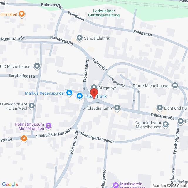 Lehrlingsportal.at Die Karte zeigt einen zentralen Bereich in Michelhausen, Österreich, mit eingezeichneten Straßen, lokalen Geschäften und öffentlichen Gebäuden. Eine rote Markierung zeigt einen bestimmten Ort am Florianiplatz an.