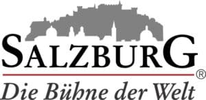 Lehrlingsportal.at Logo mit einer grauen Silhouette der Salzburger Skyline über dem Wort „Salzburg“. Darunter steht in Rot und Schwarz: „Die Bühne der Welt.“.