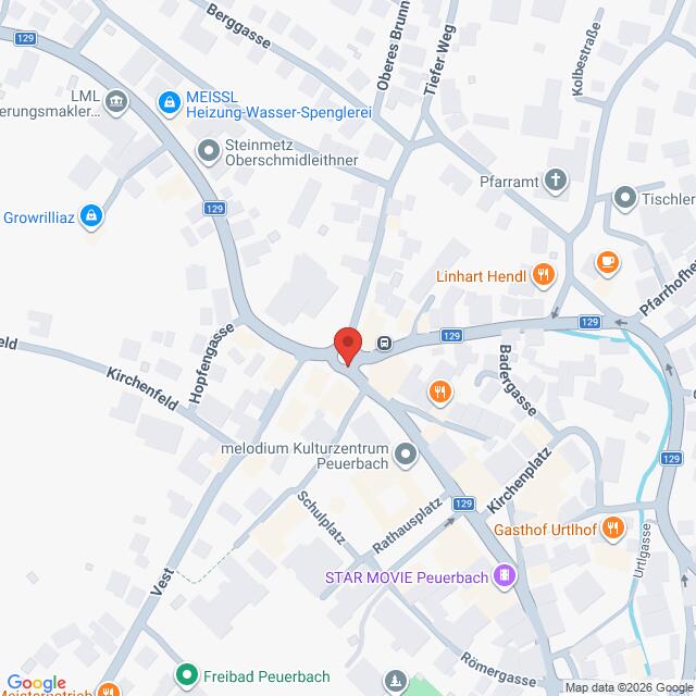 Lehrlingsportal.at Eine Google-Maps-Ansicht des Zentrums von Peuerbach, Österreich, mit einer roten Markierung, die einen Standort in der Nähe der Kreuzung mit der Bundesstraße 129 kennzeichnet.